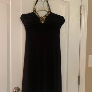Ladies black stretch dress with gold trim size 4 lower back out